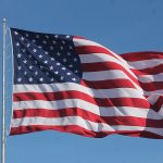 1200px-American_Flag_Waving_on_a_Flag_Pole