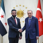 In this photo released by the Turkish Presidency, Turkish President Recep Tayyip Erdogan, right, shakes hands with Syria's interim President Ahmad al-Sharaa during their meeting at the presidential palace, in Ankara, Turkey, Tuesday, Feb. 4, 2025. (Turkish Presidency via AP)