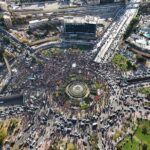 DAMASCUS, SYRIA - DECEMBER 13: In this aerial view, people celebrate in Umayyad Square after Friday Prayers on December 13, 2024 in Damascus, Syria. Last week, rebel forces in Syria retook the capital from longtime ruler Bashar al-Assad, who fled the country for Moscow. The fall of the Assad regime marks a new chapter for Syria, which has been mired in a multi-party civil war since 2011, sparked by the Arab Spring uprisings. (Photo by Ali Haj Suleiman/Getty Images)